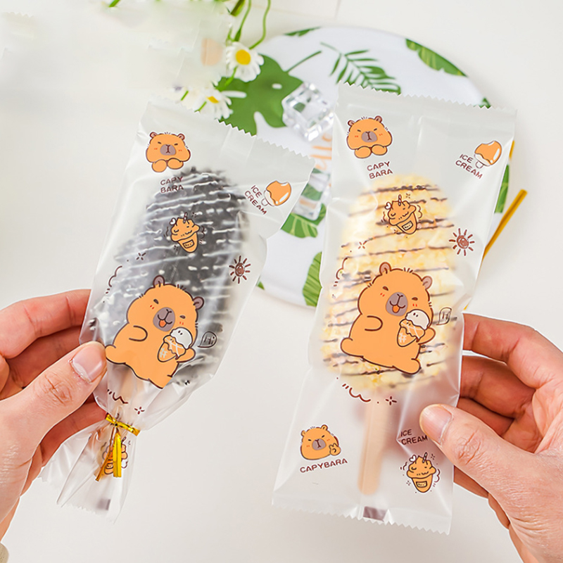 Food Storage Bag - ～100個入り かわいい漫画柄の食品グレードアイスクリーム袋、使い捨てプラスチック製アイスキャンディー保護カバー、収納用包装袋、DIY用